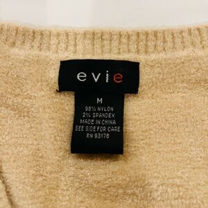 Perfect to complete your winter look! Evie Brand tan sweater.